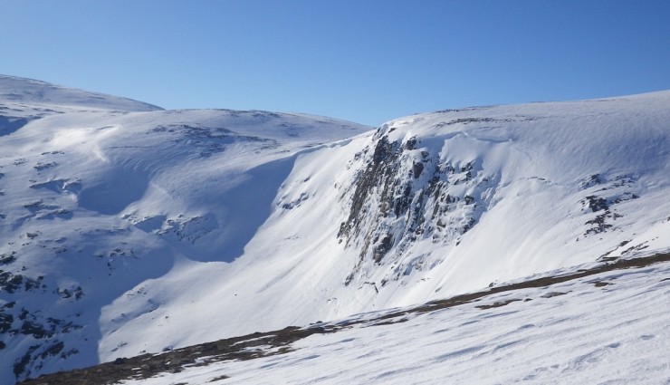 Cornices above East aspects on Hells Lum crag the Feith Bhuidhe in the background