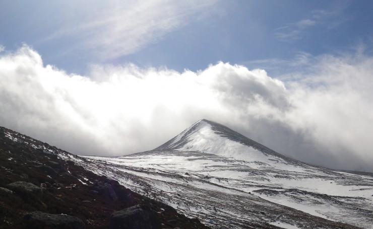 Clouds race over the summits in the gale force winds.
