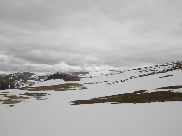 Large snow fields on the plateau.  Ben MacDui in the distance