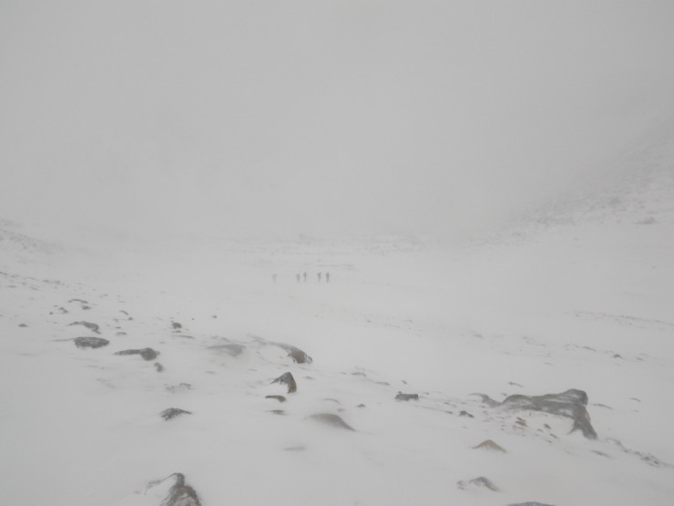 A party crossing Coire an t Sneachda in the gloom