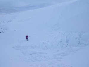 New snow and easing winds.